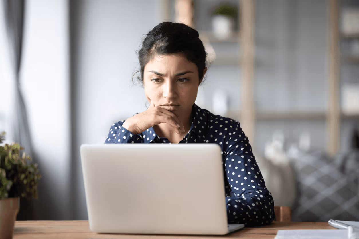 Concerned woman at laptop