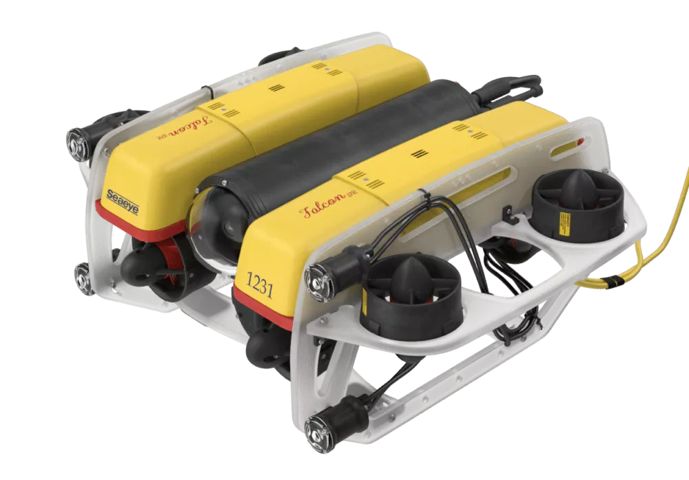 A pair of yellow and black snowmobiles sitting on top of each other