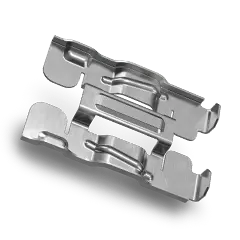 A pair of metal clips on a black background
