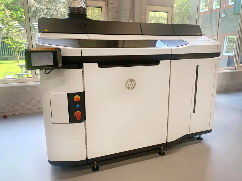 A Mult Jet Fusion 3D printer being used in production