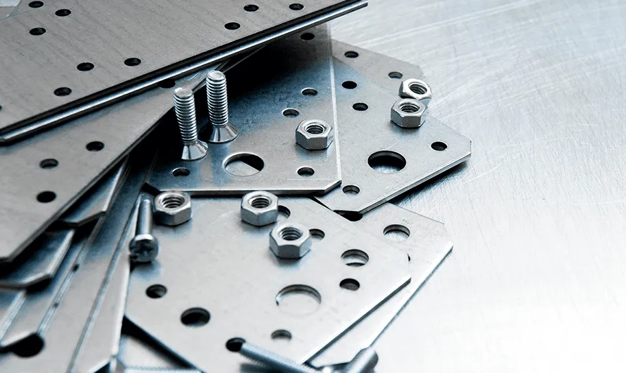 A pile of metal parts sitting on top of a table