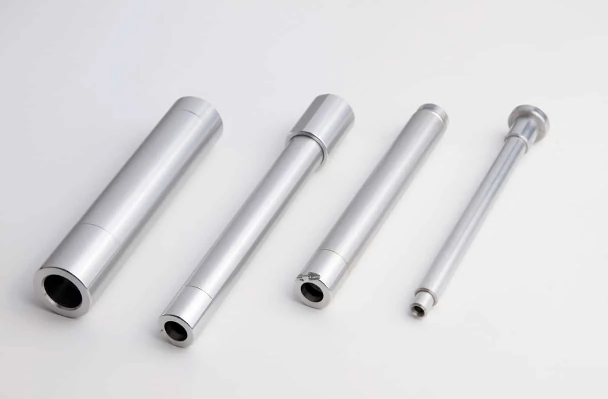 A several silver objects on a white background.