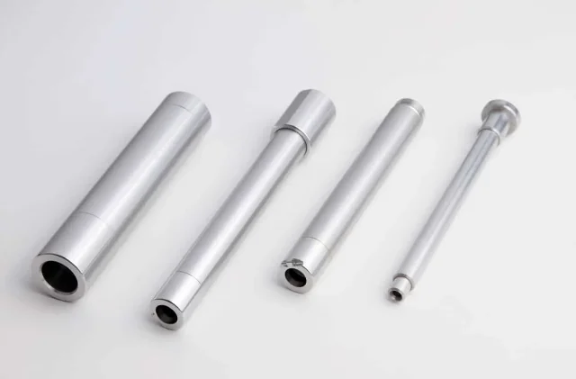 A several silver objects on a white background.