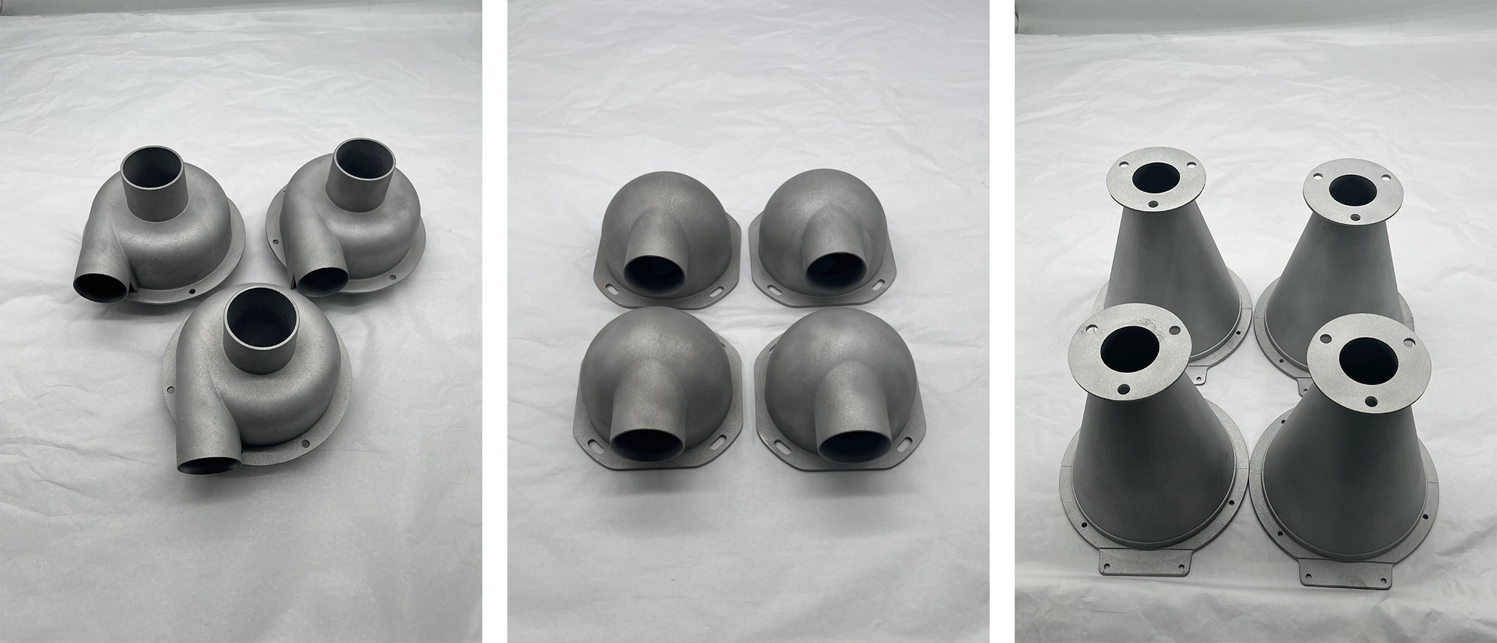 Three sets of metallic industrial pipe connectors on white background