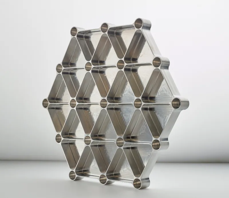 Precision machined metal cube with multiple threaded circular holes