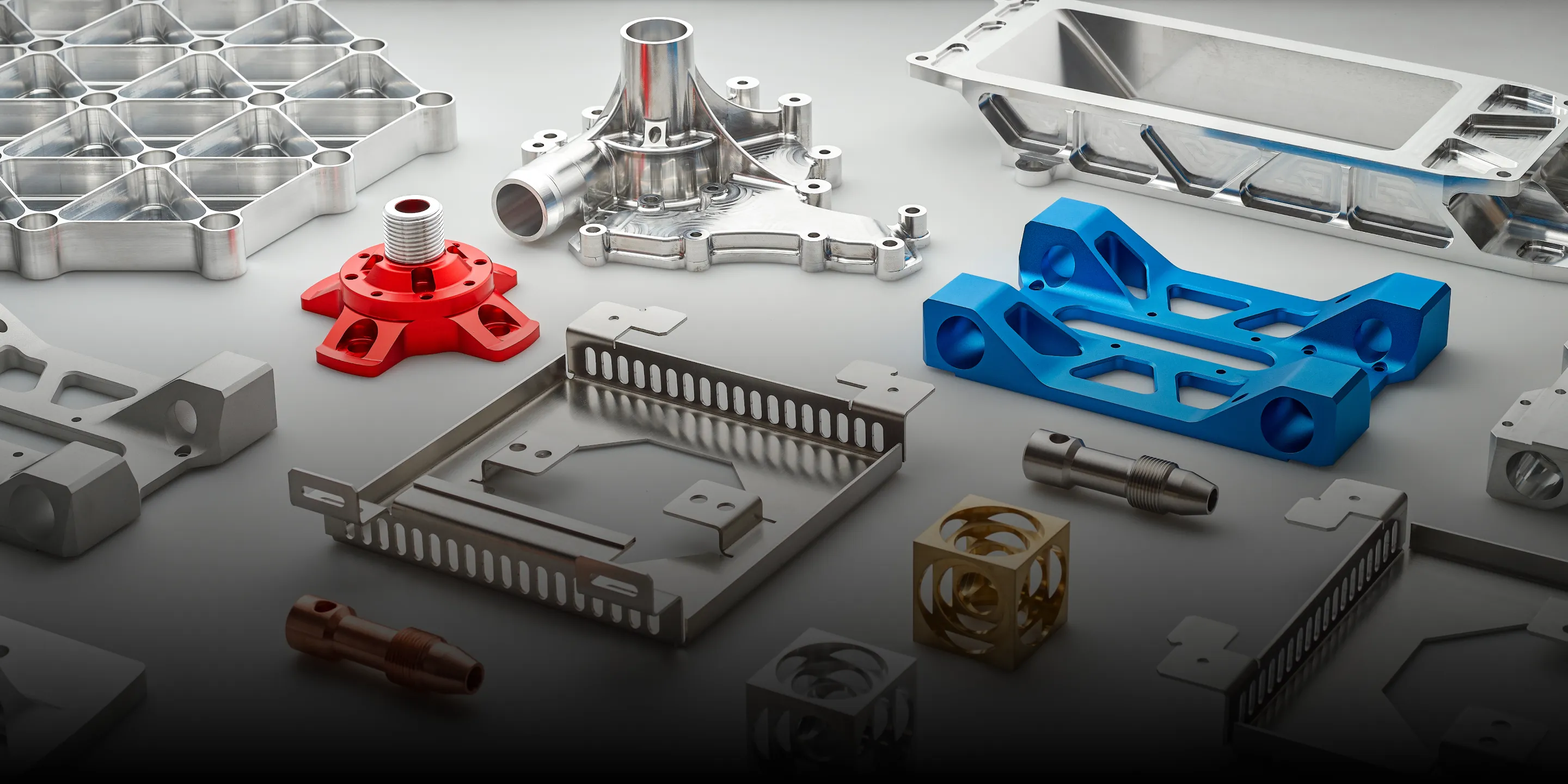 A pair of aluminum parts on a white background