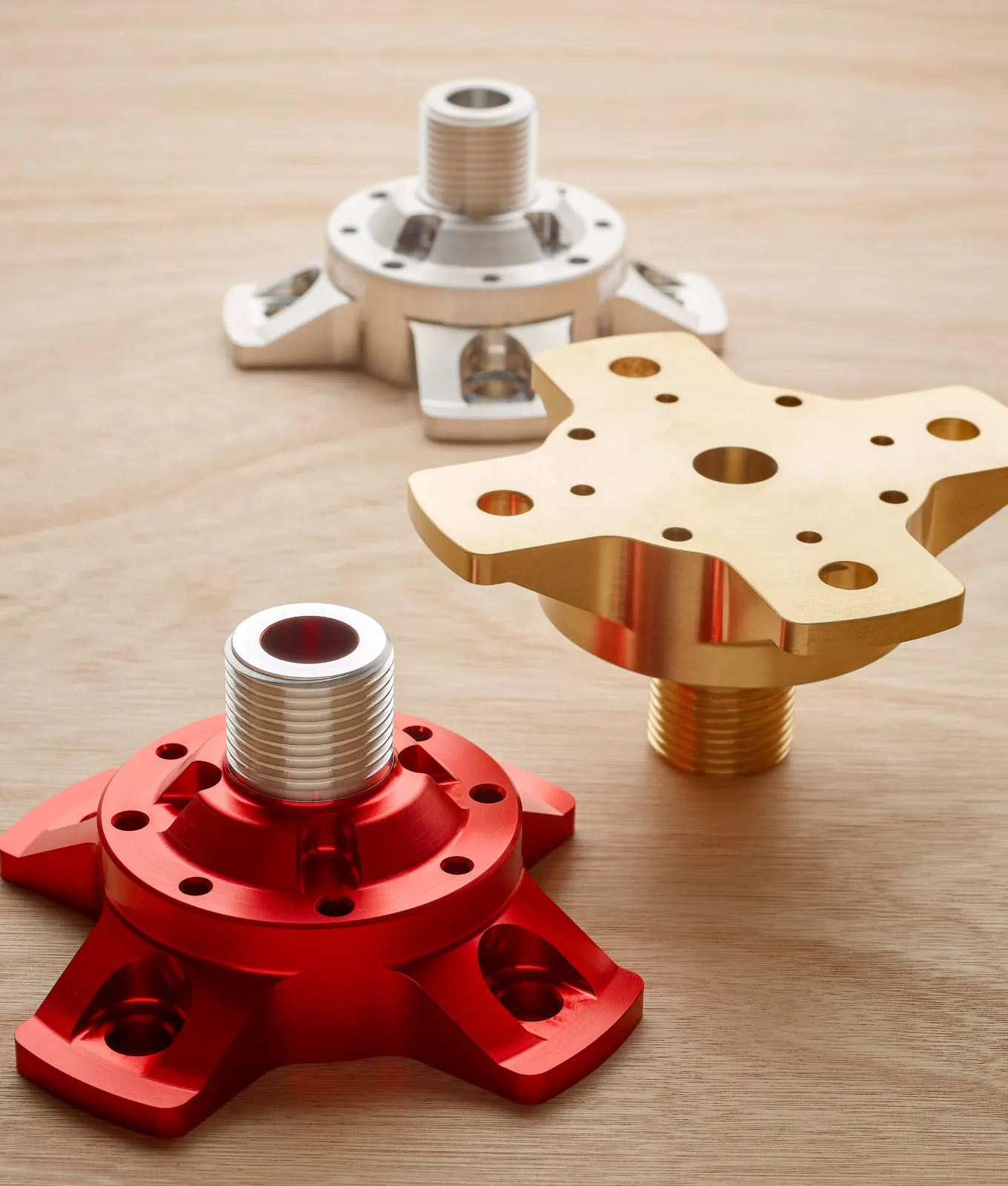 A pair of aluminum parts on a white background