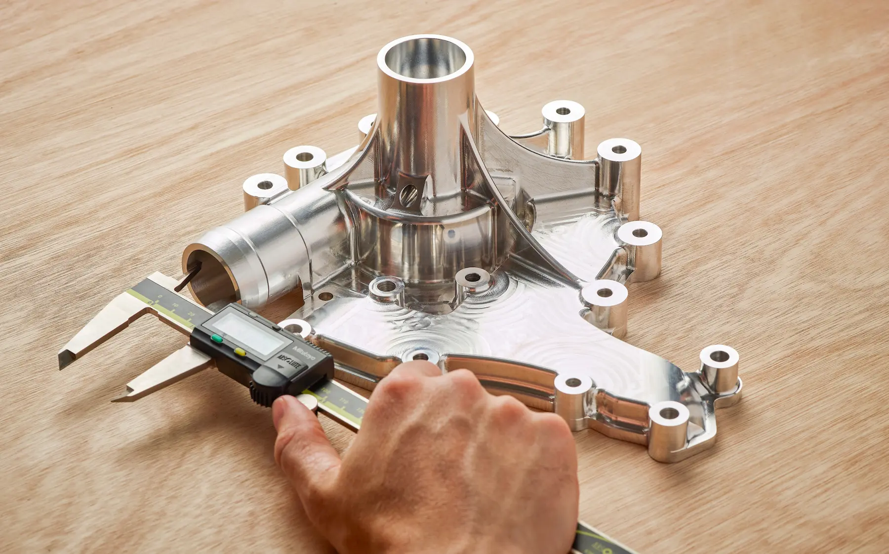 CNC machine drilling precise hole in metallic industrial workpiece