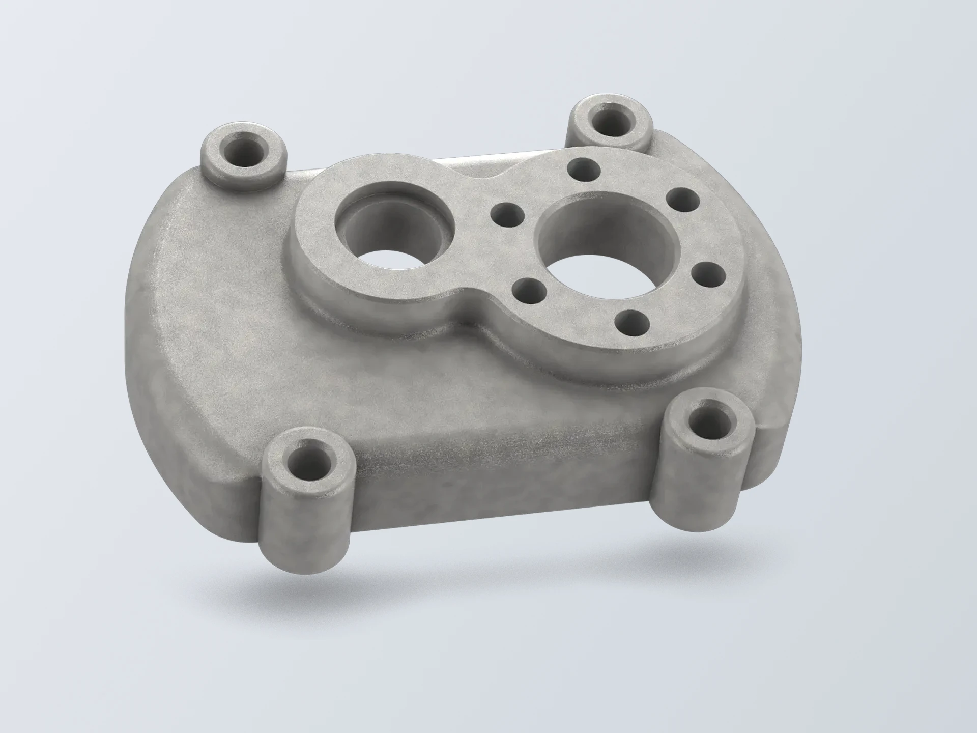 Intricate metal engine block with multiple circular openings and complex geometry
