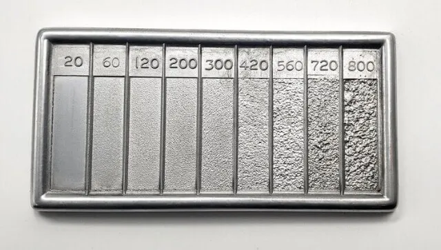 A metal plate with numbers explaining the roughness.