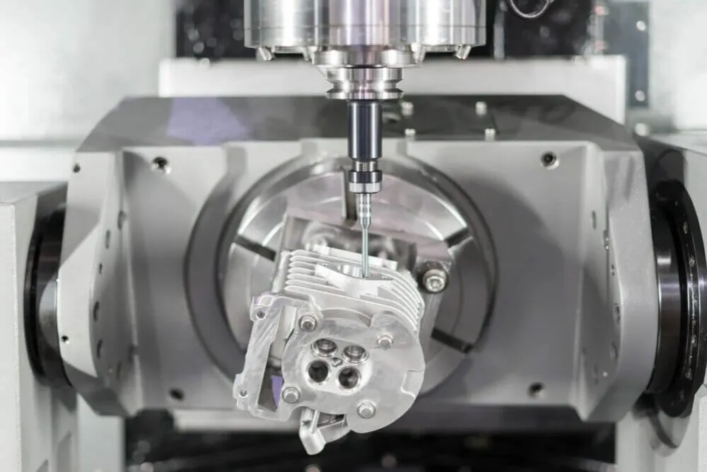 A close-up of a machine with a metal part.