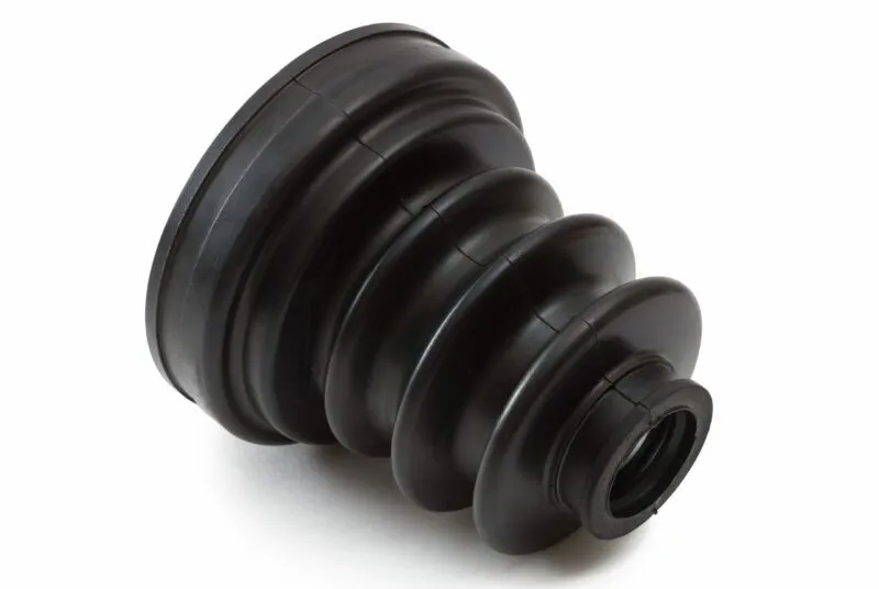 A black plastic object on a white surface