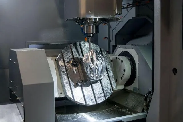A machine with a metal object on it.