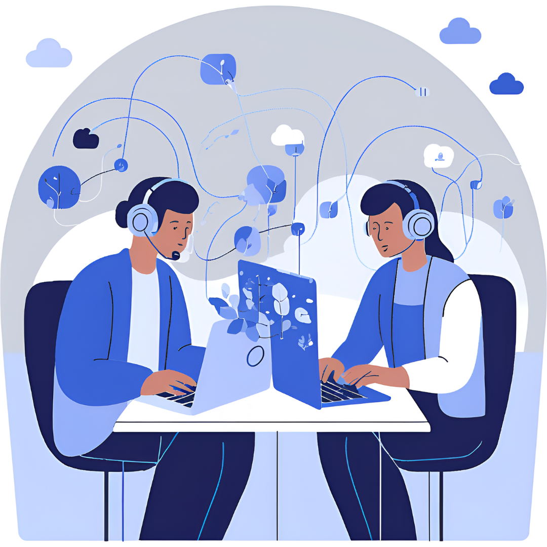 Two workers sit at a table facing each other with separate laptops and headsets.