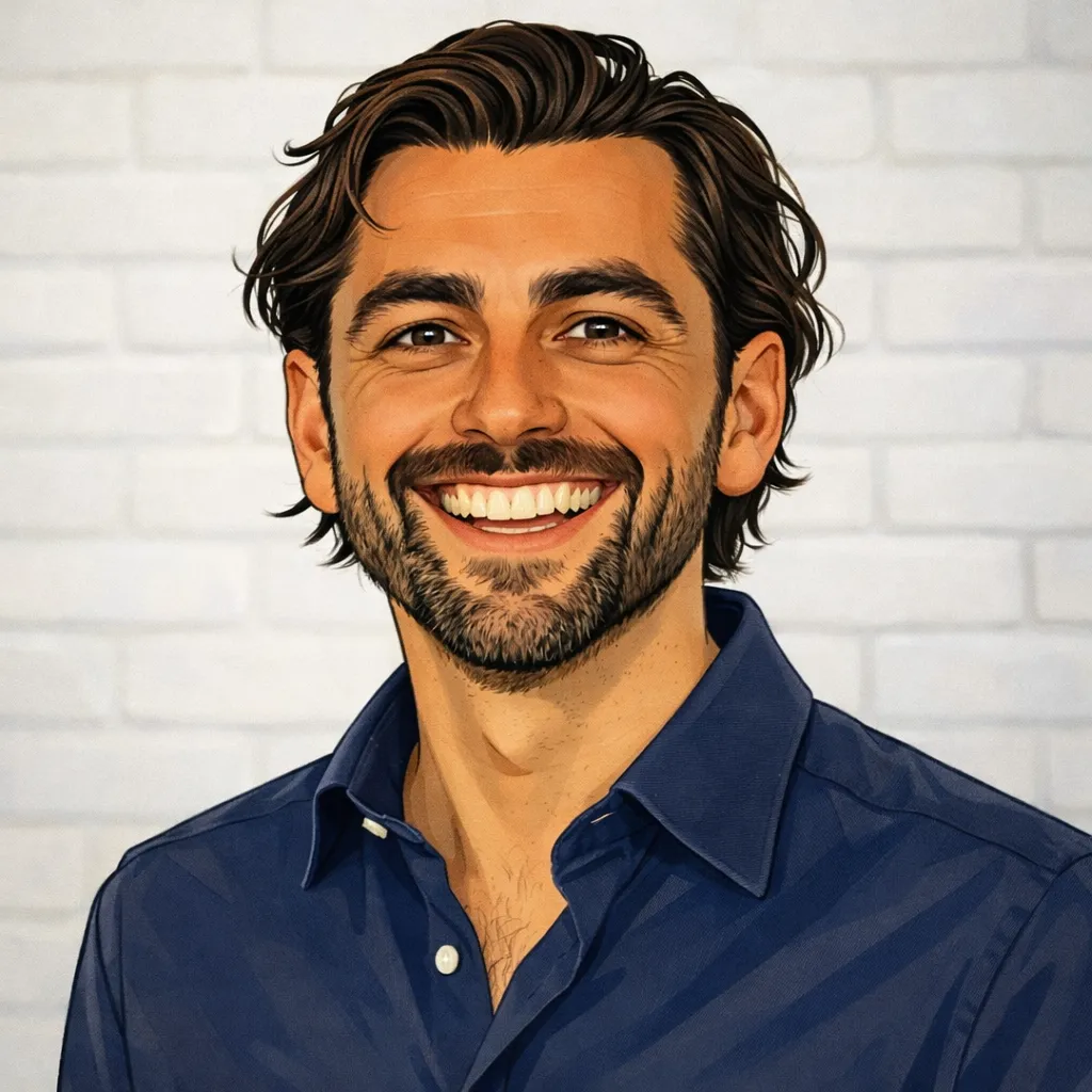 Dashly - Smiling man with dark hair and beard wearing a blue shirt against a white brick wall background.