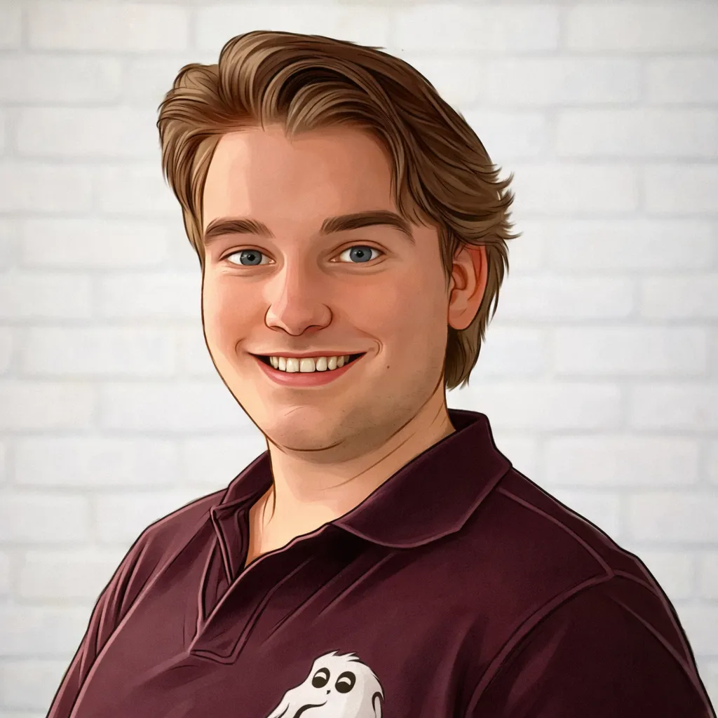 Dashly - Smiling young man with light brown hair wearing a maroon polo shirt featuring a white ghost logo, standing against a white brick wall background.