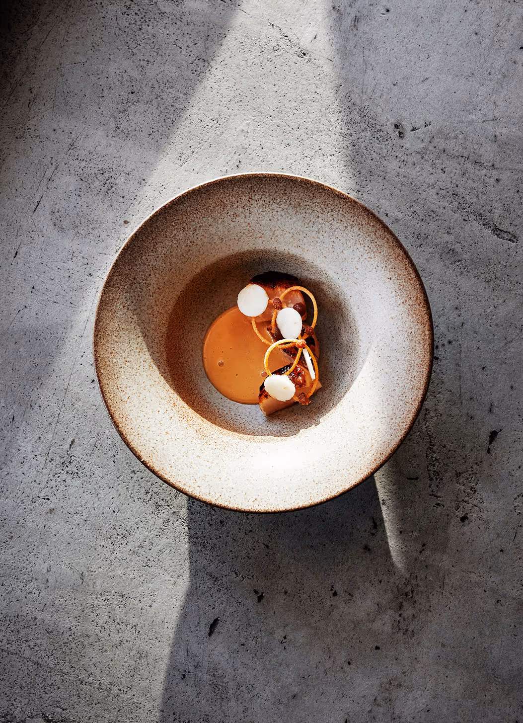 A plated dish on a stone background.