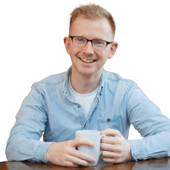 An image of Toby sitting at a table