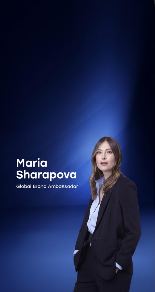 Maria Sharapova in a black suit and light blue shirt stands against a blue gradient background.