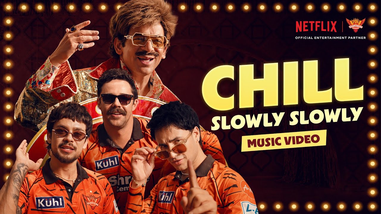 Four men wearing sunglasses and orange shirts posing with text 'Chill Slowly Slowly Music Video' and Netflix logo.