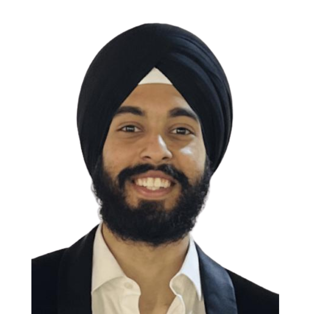 Smiling man with beard wearing a black turban, white shirt, and black jacket.