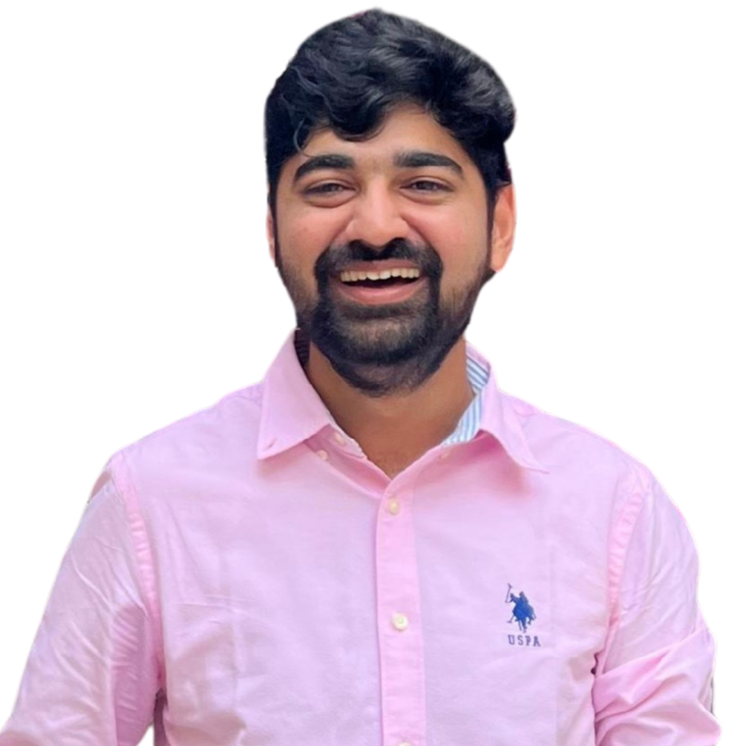 Smiling man with dark hair and beard wearing a light pink button-up shirt with a USPA logo.