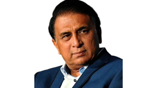 Man with dark hair wearing a blue suit jacket and light blue shirt, looking to the side.