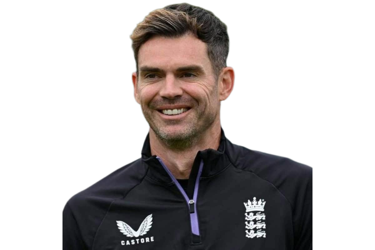 Man smiling wearing black zip-up sports jacket with England cricket team logo and Castore emblem.