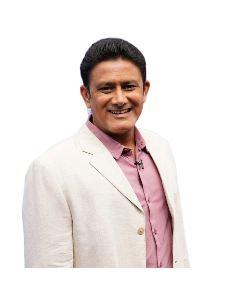 Smiling man in a cream blazer and mauve shirt against a black background.