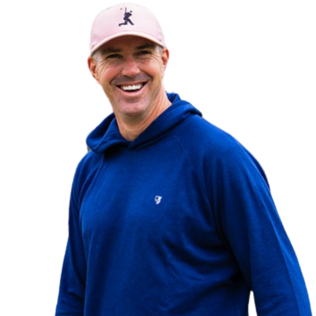 Smiling man wearing a light pink baseball cap with a black silhouette logo and a blue hoodie.