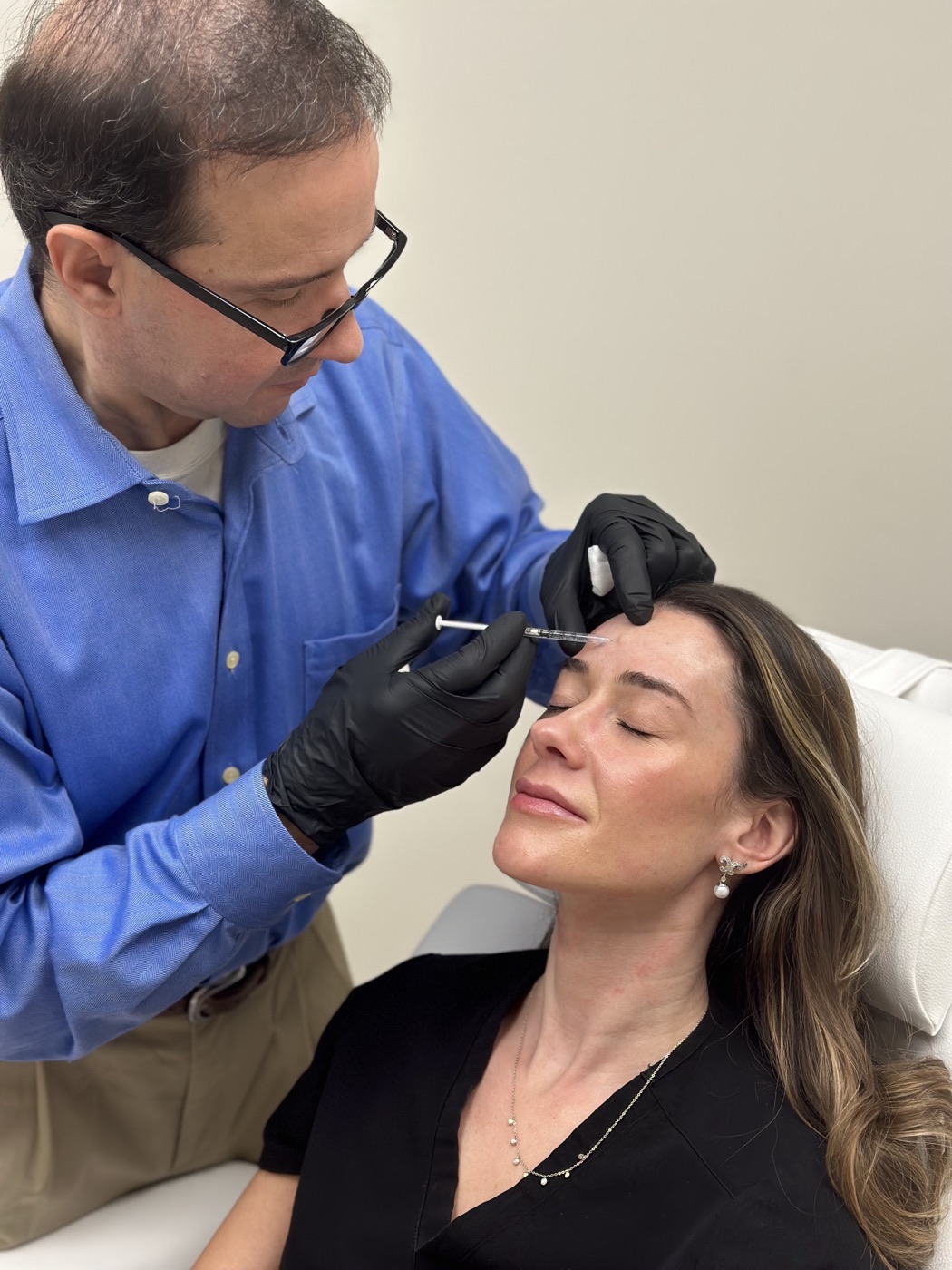Dr. Sean Silvernagel, M.D., Owner and Medical Director, administering an injectable treatment at Nashville Skin Company