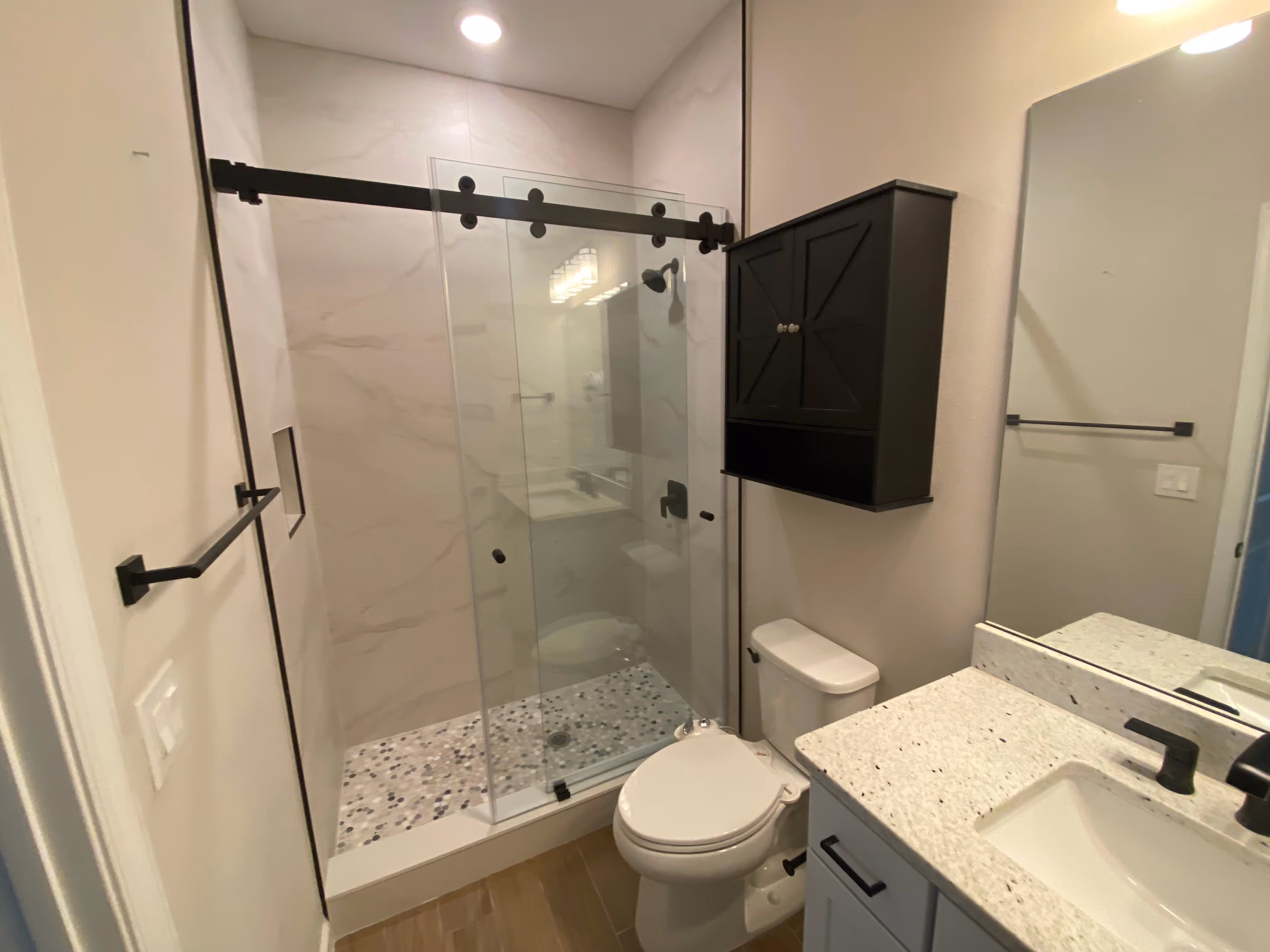 Bathroom shower with custom glass and tiling