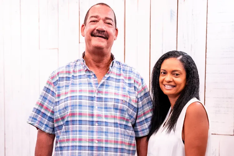 Friendly Bambou Resort staff smiling at the white wall Martinique