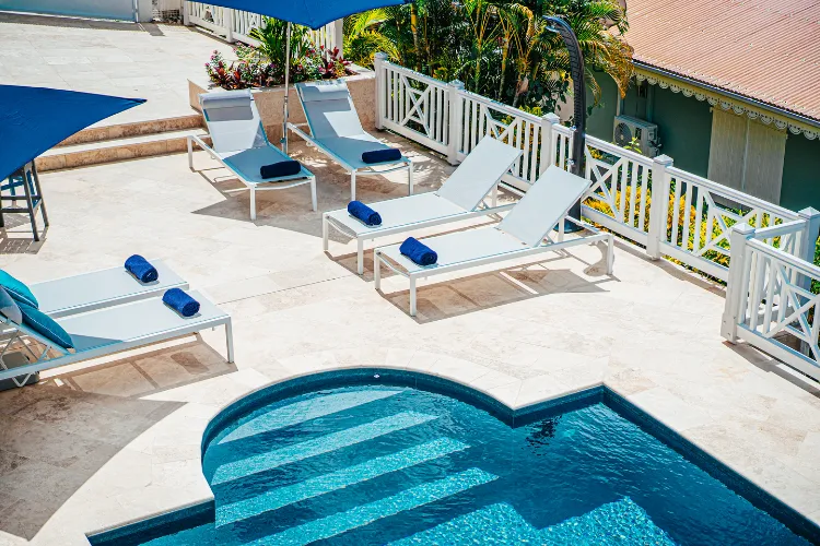 Luxurious deckchairs lining the private pool and tropical terrace of Bamboo Resort Martinique
