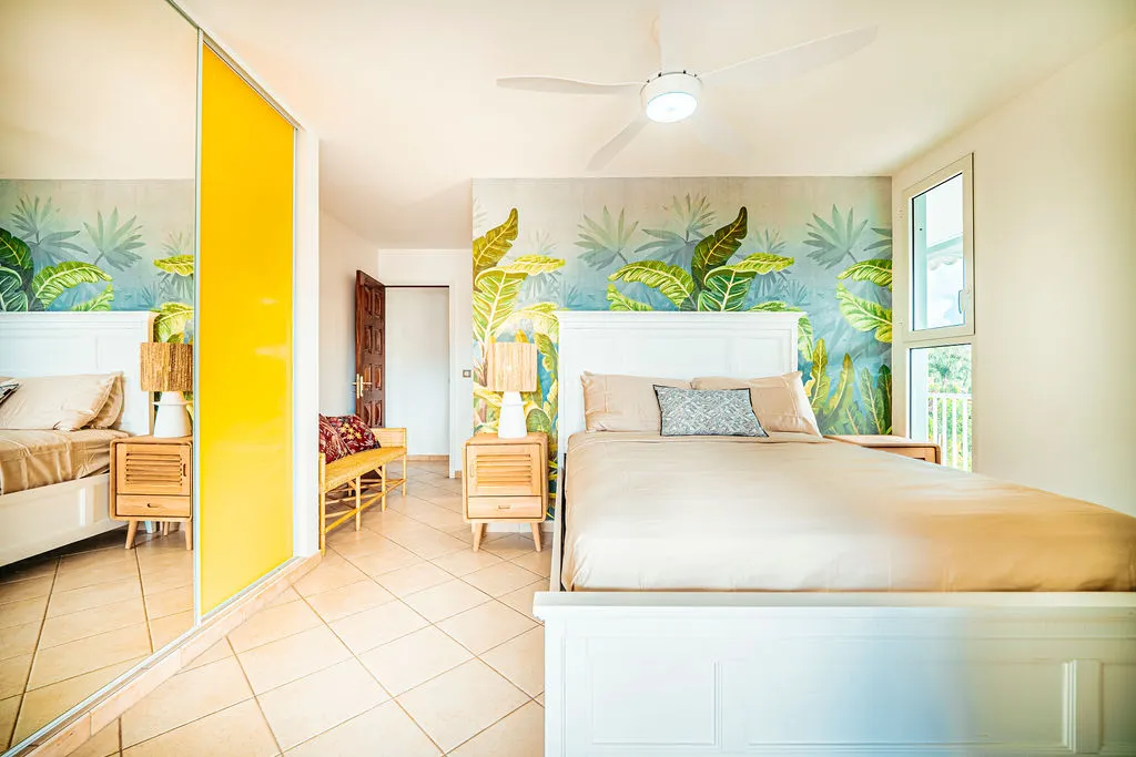Luxury room Villa Escapade tropical decor wall palm trees Bambou Resort Martinique