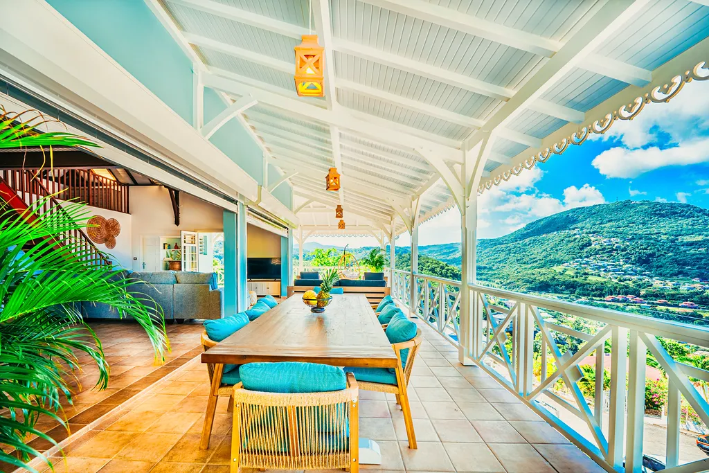 Panoramic terrace luxury villa Bambouresort overlooking Martinique bay palm trees designer furniture
