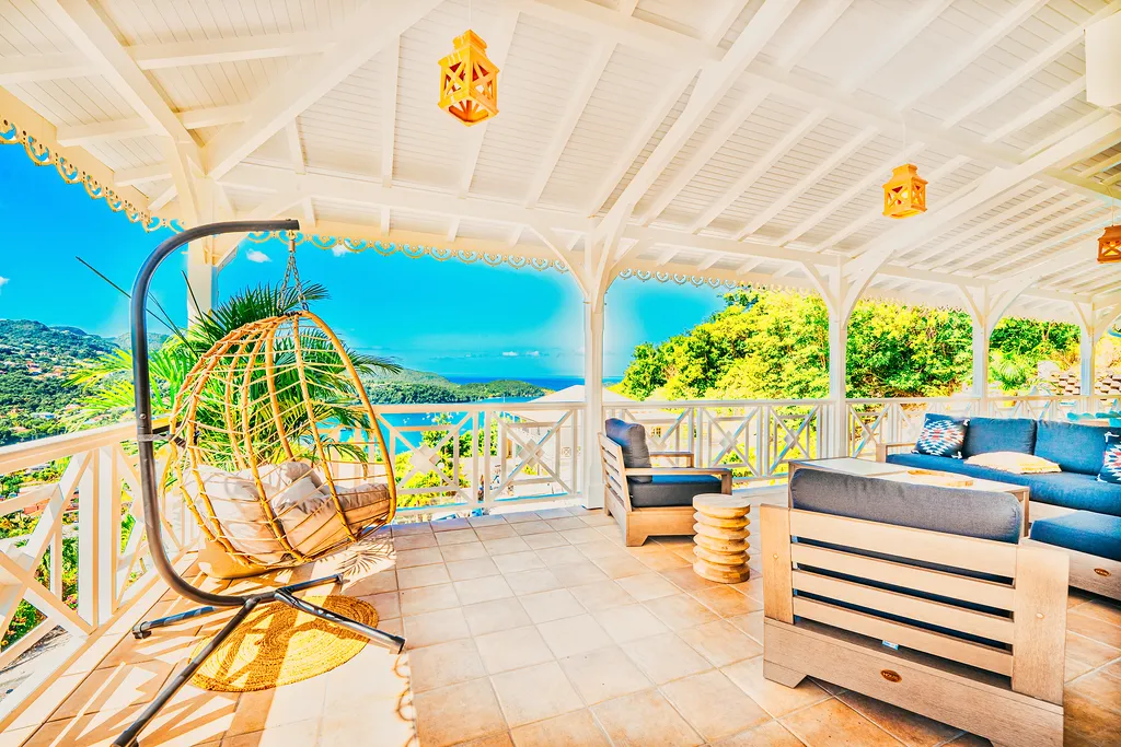 Luxury terrace villa Martinique hanging armchair sea view Bambouresort