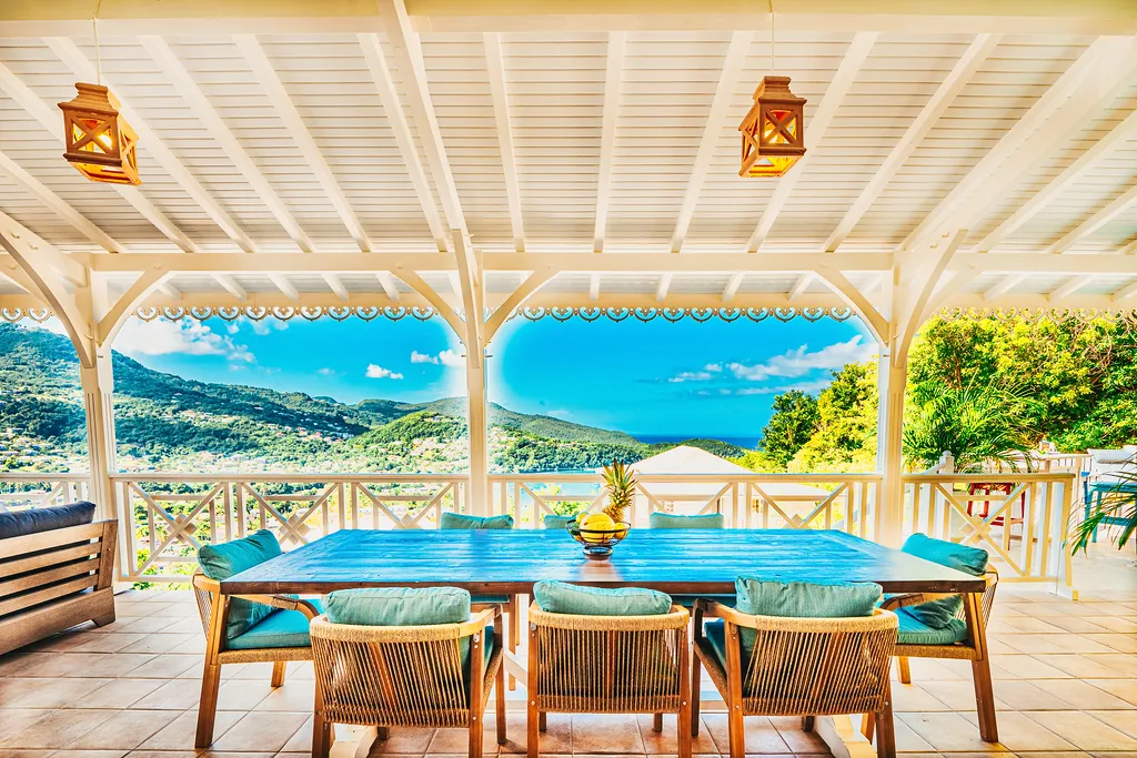 Luxurious terrace villa Martinique overlooking turquoise bay green mountains