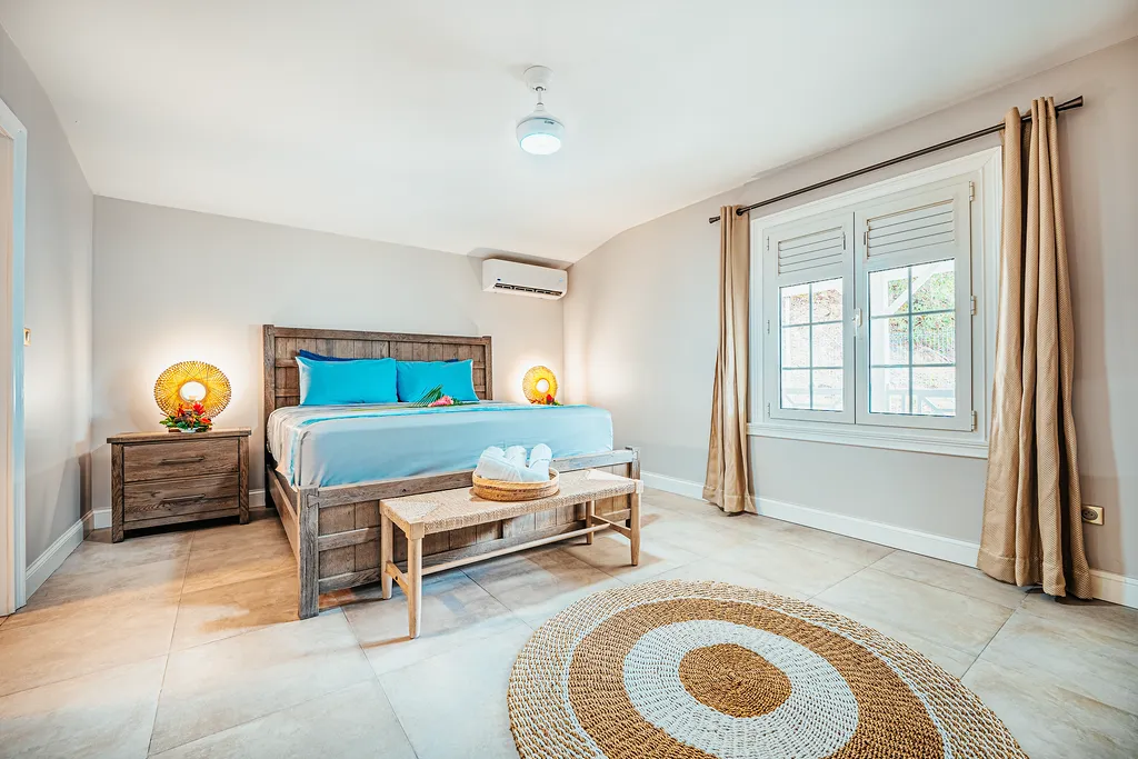 Luxury room villa Vent des îles turquoise bed Bambou Resort Martinique