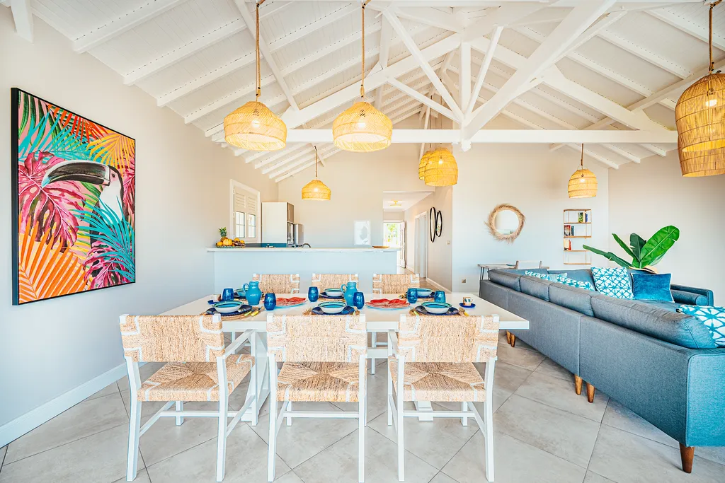 Dining room luxury villa Martinique white cathedral ceiling hanging bamboo tropical