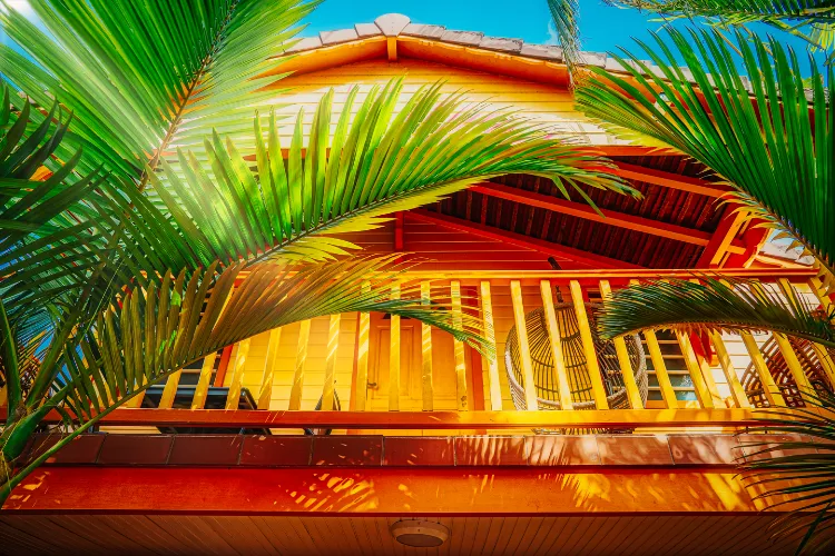 Luxury bungalow Harmonie orange roof tropical palm trees Bambou Resort Martinique