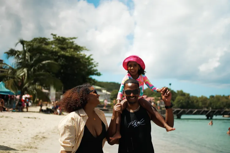 Family enjoying a sunny day on a paradise beach Martinique BambouResort