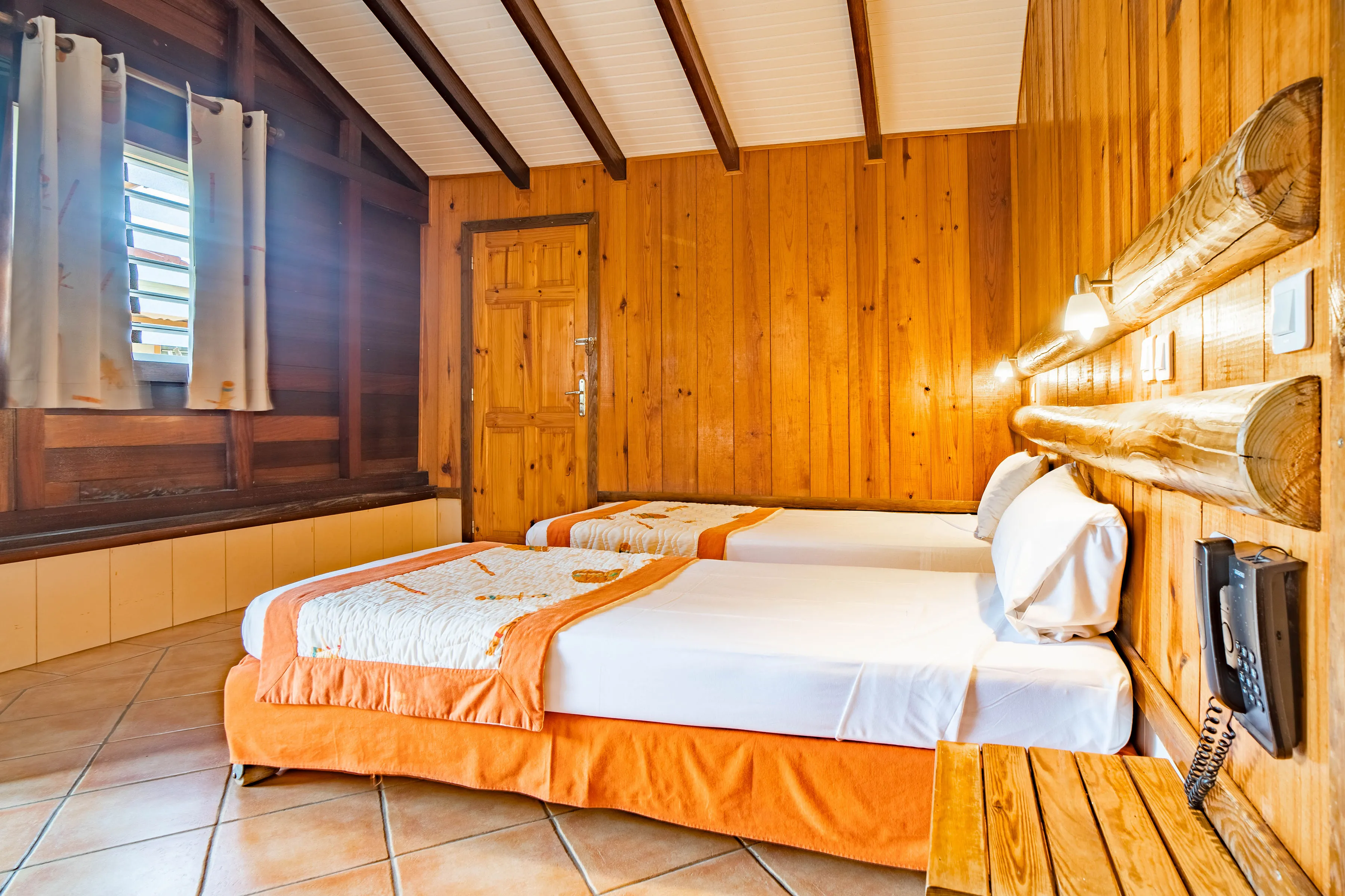 Room bungalow bamboo double bed tropical wood walls Bambouresort Martinique