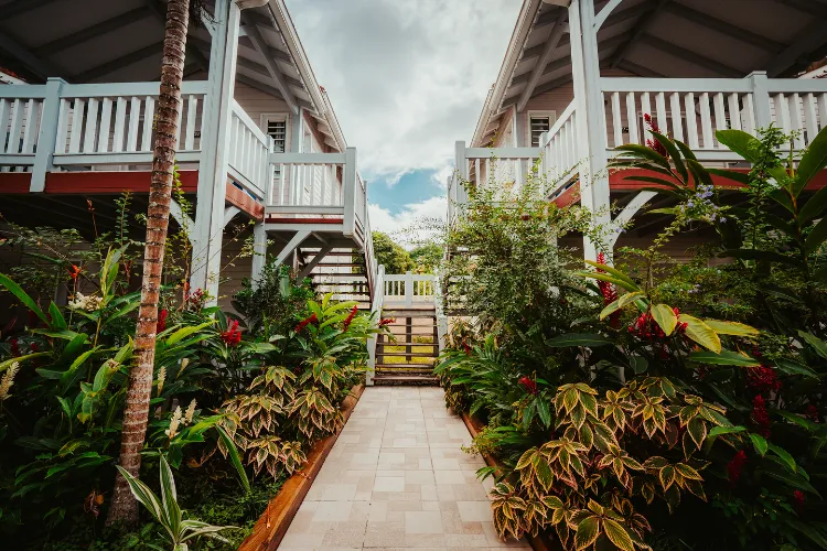 Luxury bungalows white terrace tropical garden Bambouresort Martinique