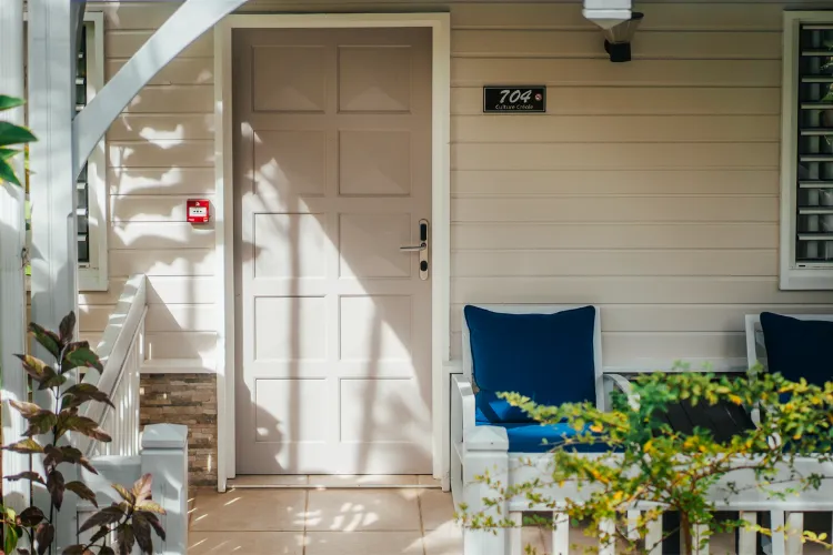 White door luxury bungalow Bamboo Resort surrounded by tropical plants Martinique