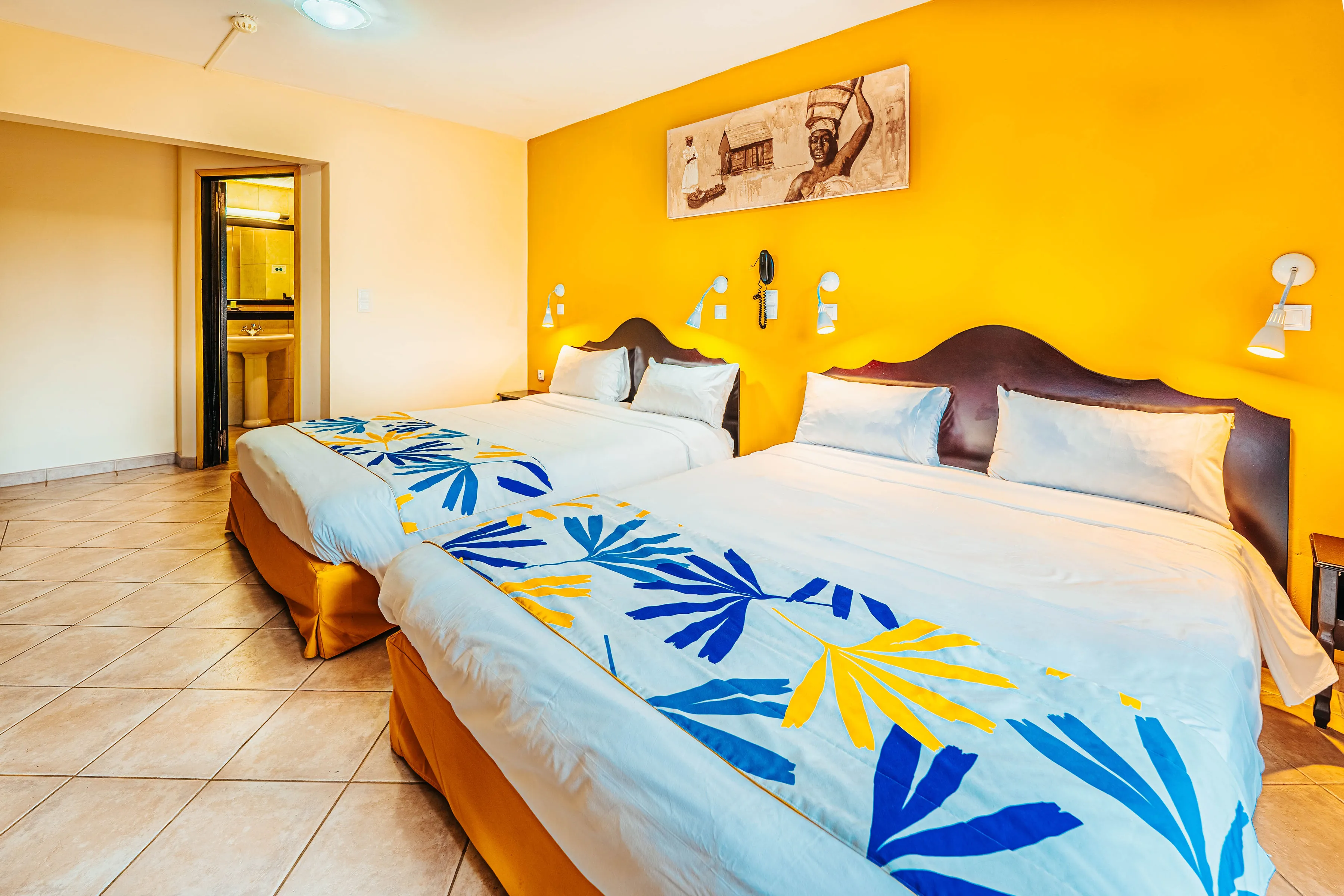 Gran Kay family room two double beds tropical motifs yellow wall tiles