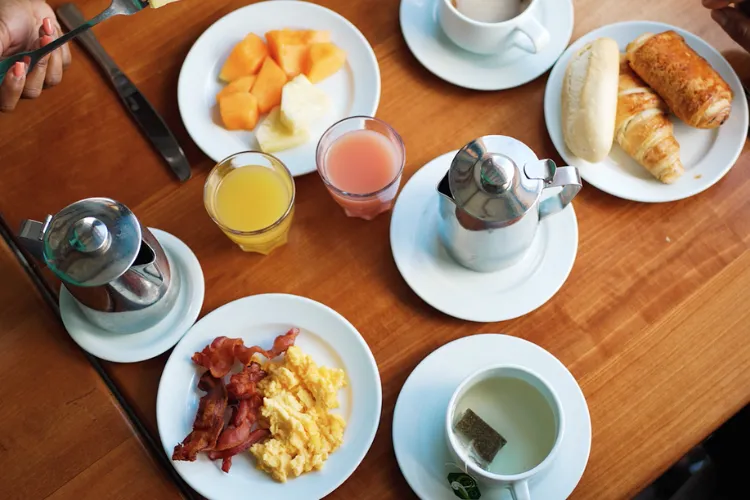 Breakfast buffet with tropical fruits eggs bacon viennoiseries fresh juice Bambouresort Martinique