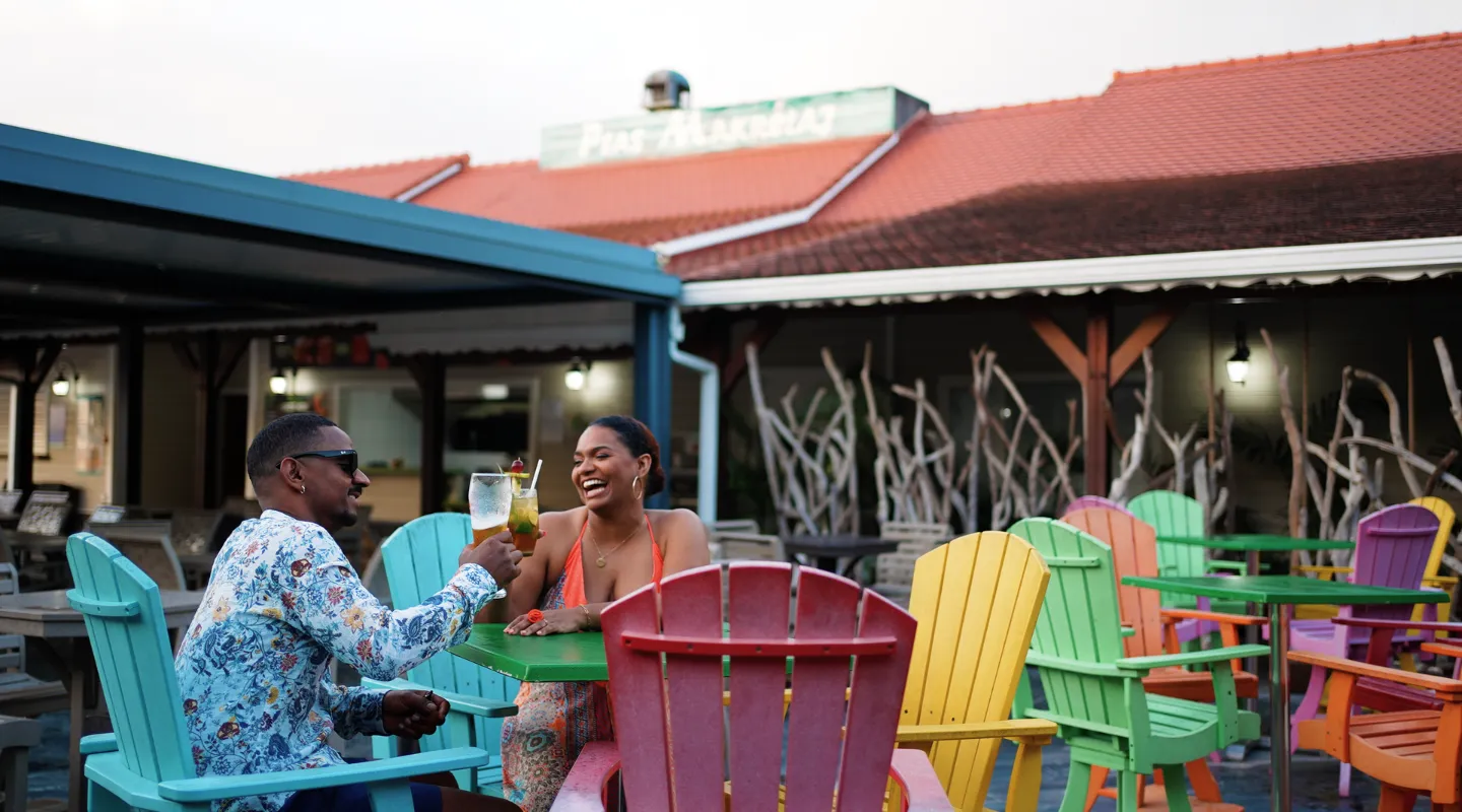 Barik Bar's colorful terrace with Adirondack chairs cocktails relaxing atmosphere Martinique
