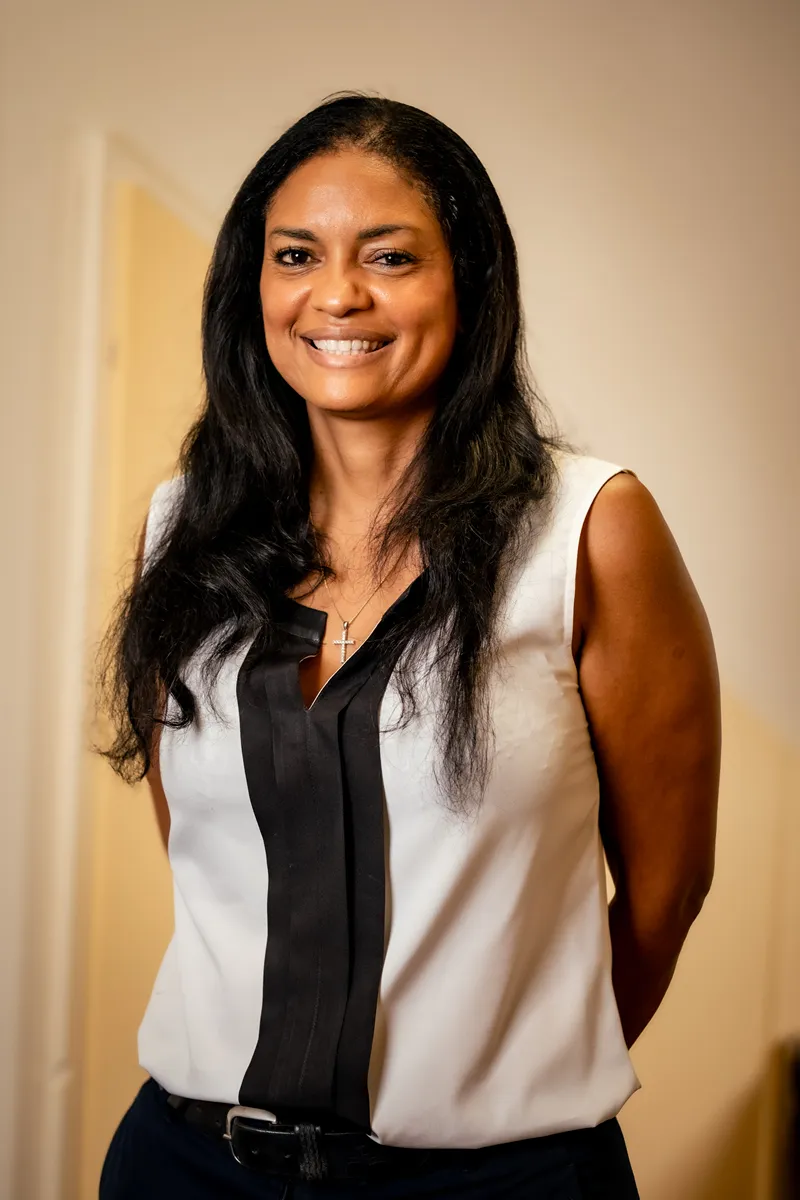 Martinique luxury resort manager posing in elegant professional attire