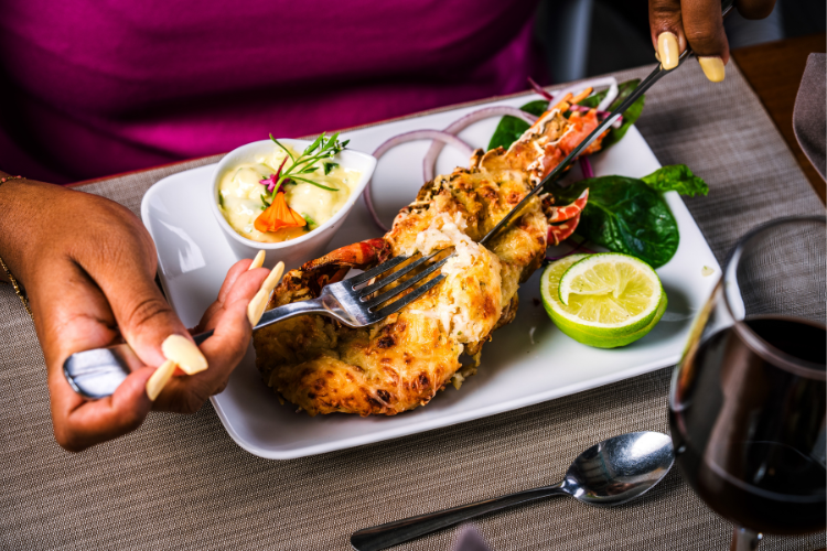 Grilled lobster with local spices served with Creole sauce and citrus fruits restaurant Bambou Resort Martinique